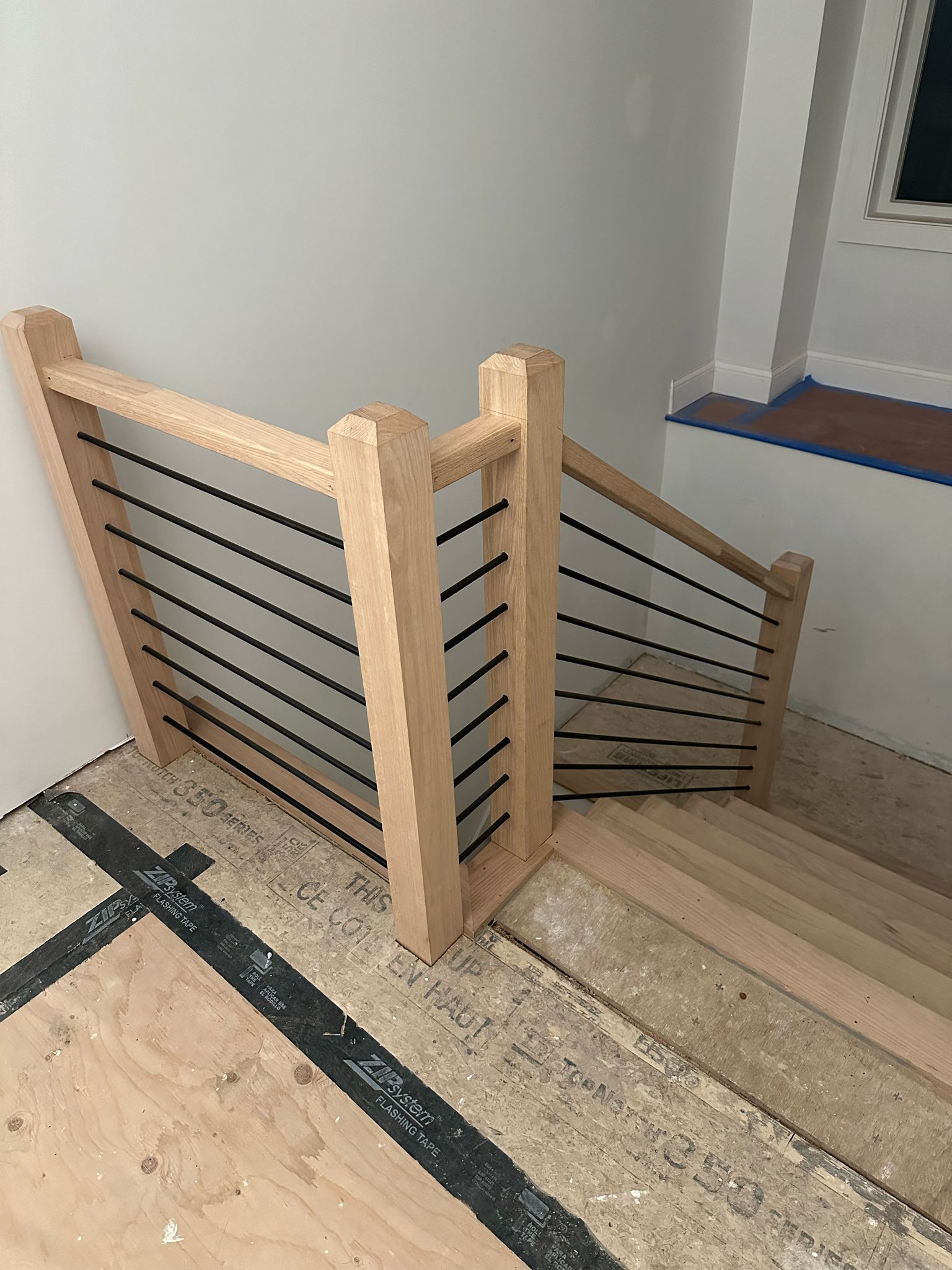 Staircase railing detail with wooden posts