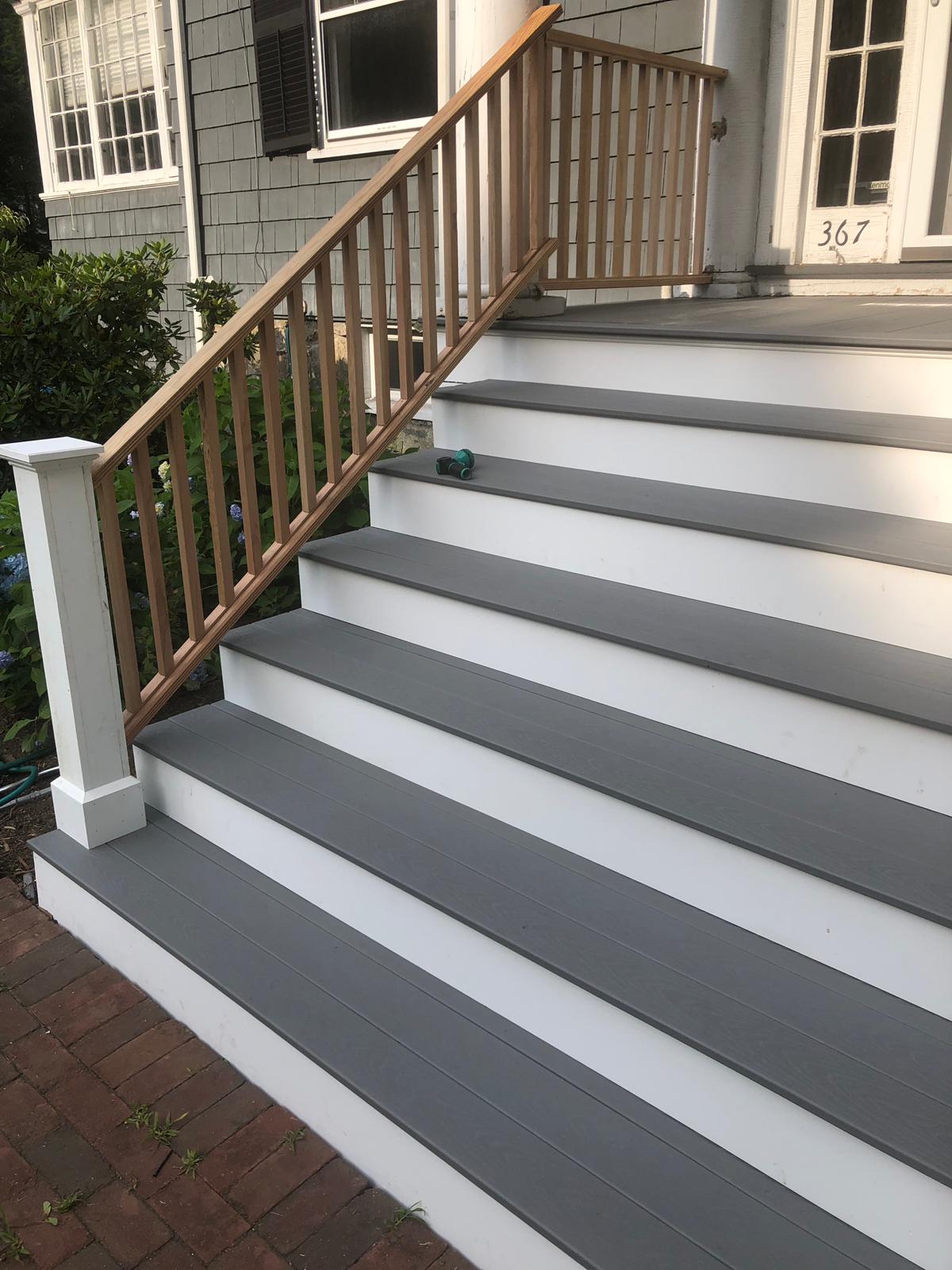 Close-up of deck stairs with gray treads and white risers