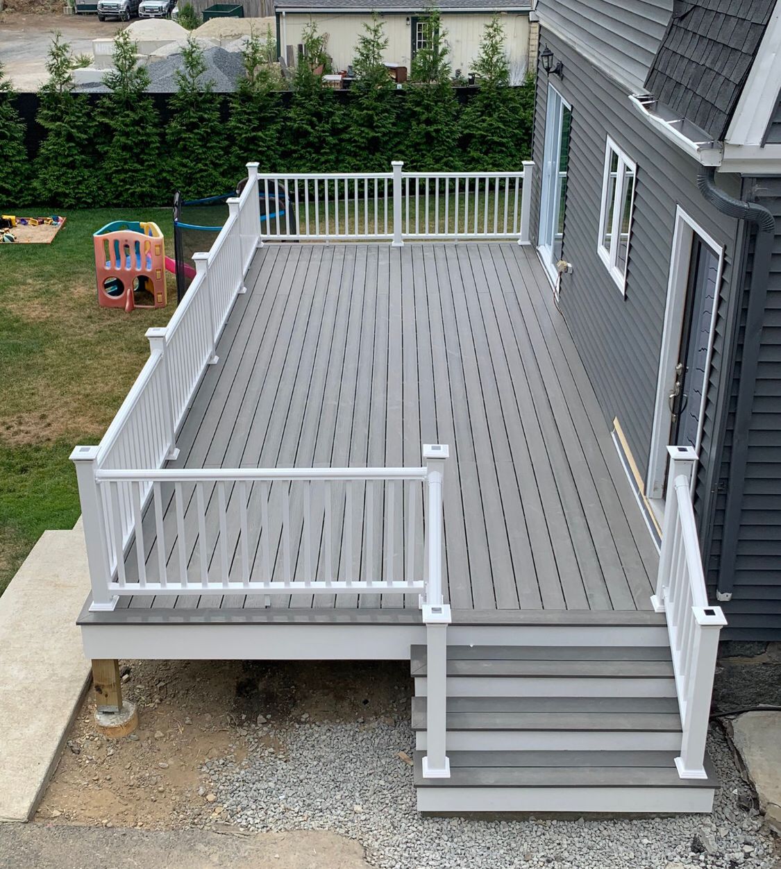 Large elevated deck with gray composite flooring - aerial view