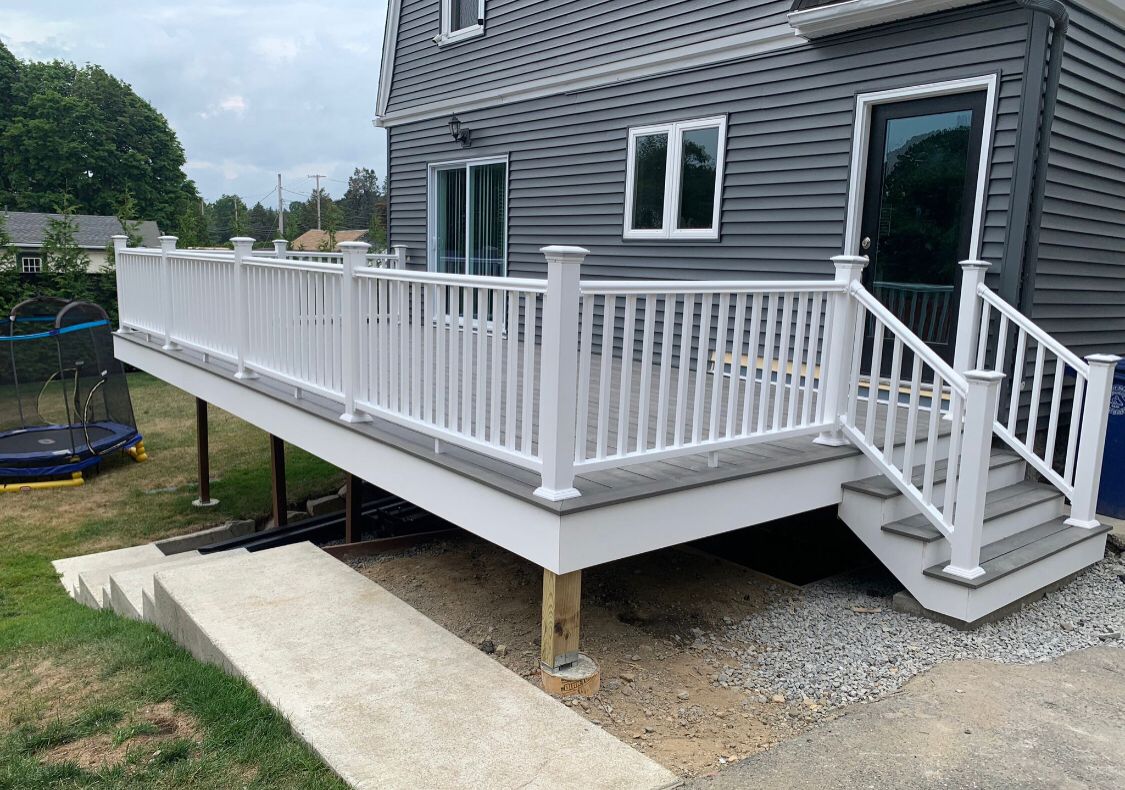 Gray composite deck with white railings