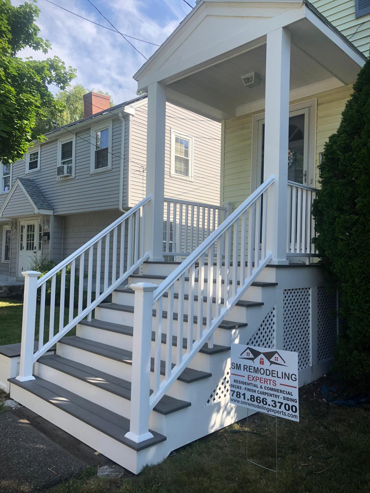 Front entrance deck with gray composite stairs