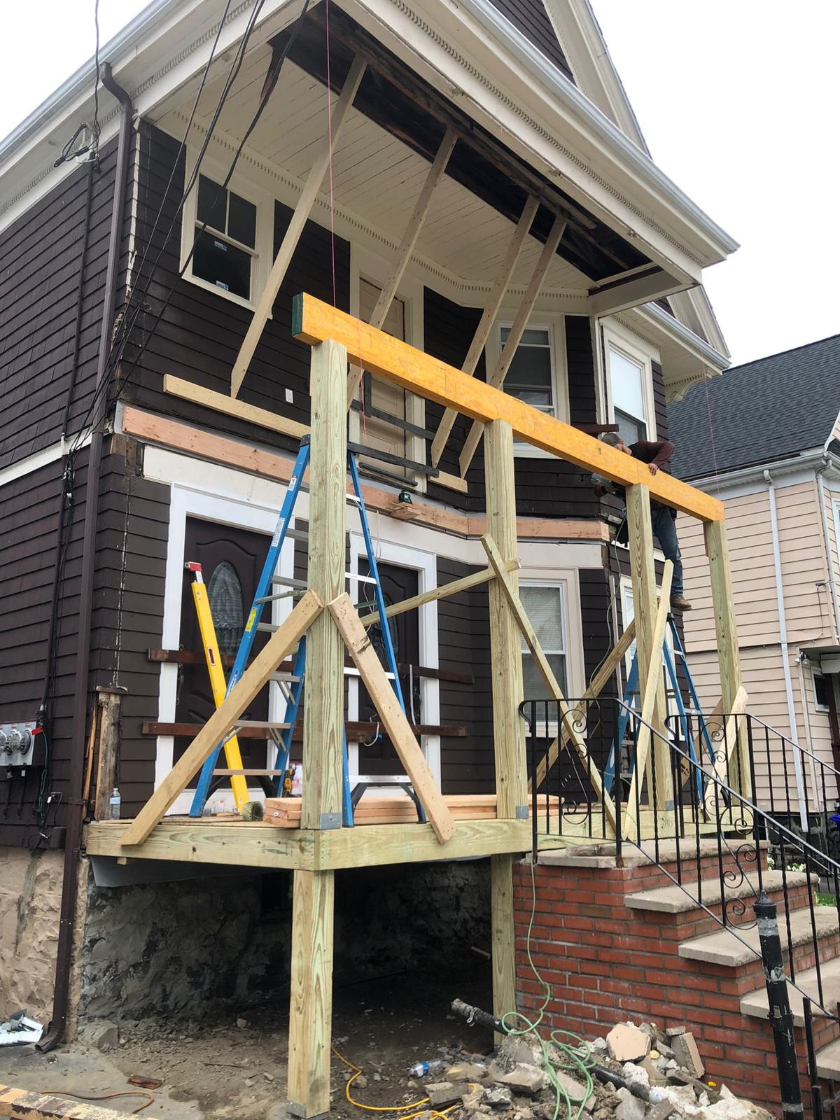 Front porch construction showing framing and structural work