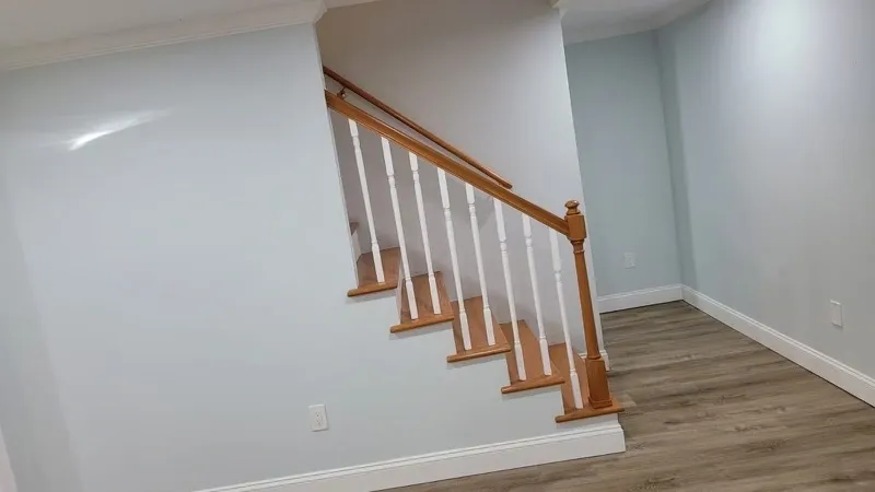 Interior remodel with luxury vinyl plank flooring and custom staircase